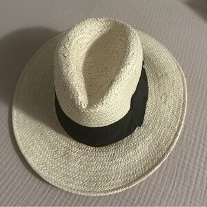 Light straw hat with black ribbon